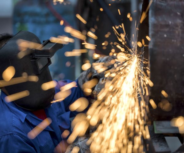 39640722 - electric wheel grinding on steel pipe in factory